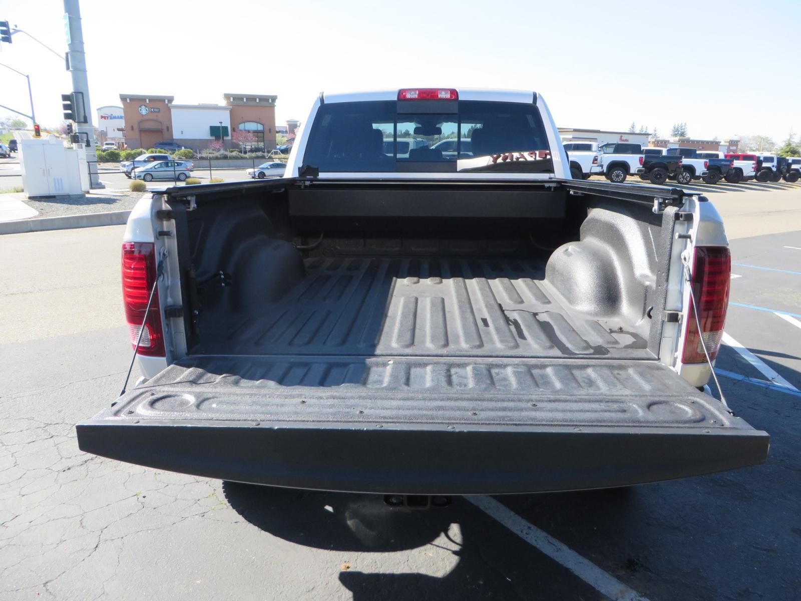 2016 SILVER /BLACK RAM 2500 Laramie Crew Cab SWB 4WD (3C6UR5FL3GG) with an 6.7L L6 OHV 24V TURBO DIESEL engine, 6A transmission, located at 2630 Grass Valley Highway, Auburn, CA, 95603, (530) 508-5100, 38.937893, -121.095482 - Leveled Ram sitting on Fuel Offroad wheels, Falken Wildpeak AT tires, Amp Power steps, Rolling Bed cover, Color matched fender flares, and window tint. - Photo #12